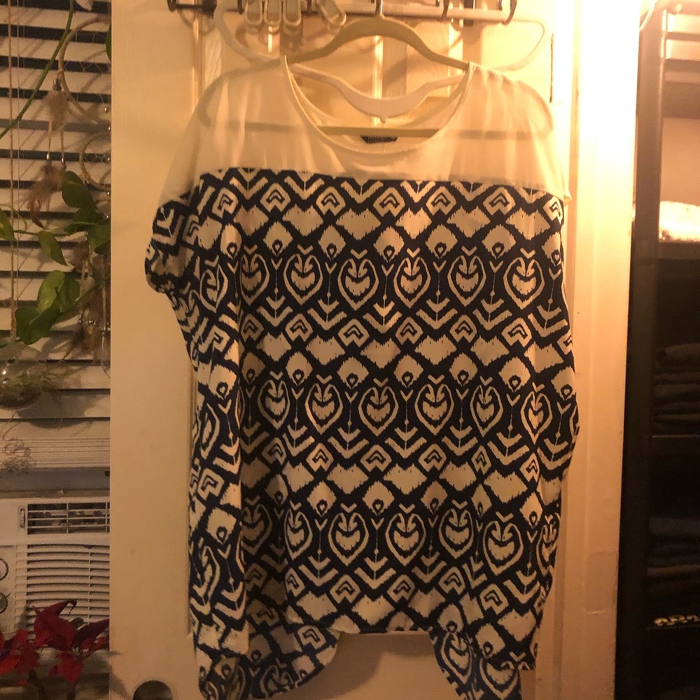 Tribal style top with open back. Thin material